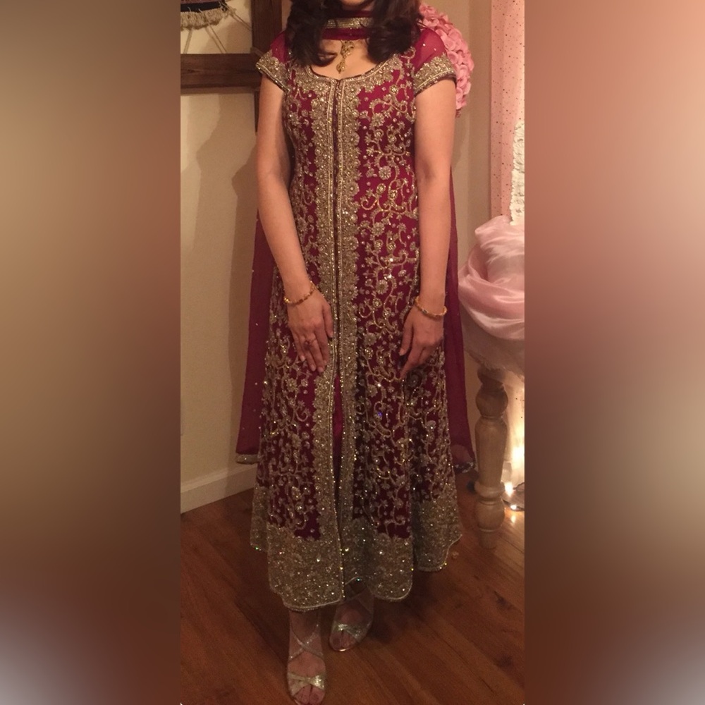 Elegant Maroon and Gold Heavily Embellished Wedding Wear